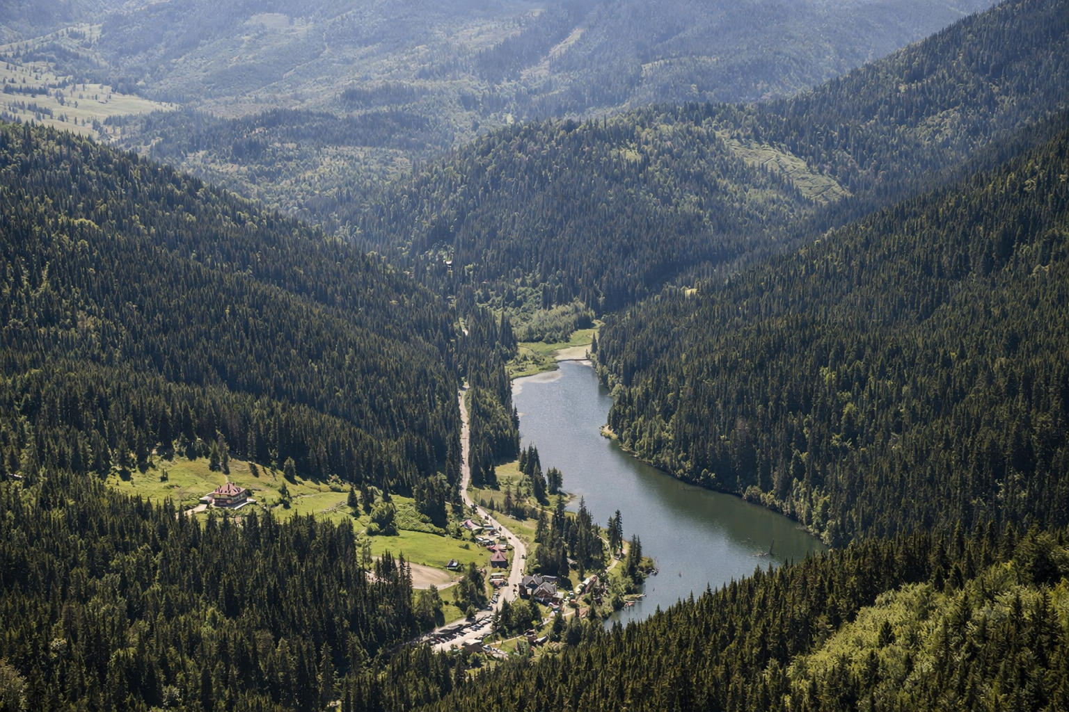 Wide view over mountain lake and valley